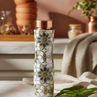 Somali Copper Bottle lifestyle image on marble surface